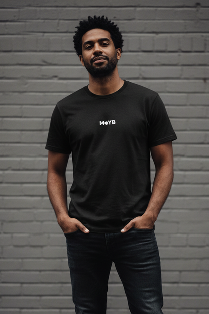 Mixed race man in MoYB Everyday Tee Black against grey brick wall