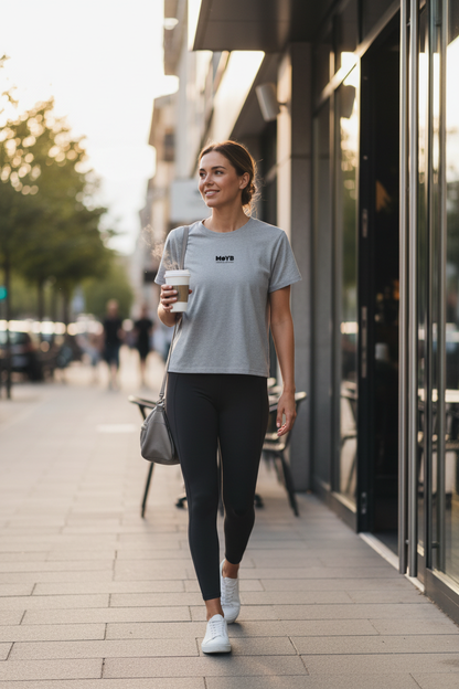 Woman on post-gym coffee run in MoYB Women's Everyday Heather Grey Tee